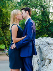 Couple hugging on a stone bridge