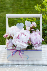 Poster - Floral arrangement with peonies in wooden box