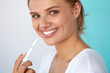 © puhhha - Woman With Beautiful Smile, Healthy Teeth Using Whitening Pen. High Resolution Image