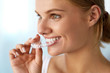 © puhhha - Smiling Woman With Beautiful Smile Using Invisible Teeth Trainer. High Resolution Image