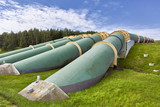 Fototapeta Łazienka - Industrial zone, Steel pipelines and valves against blue sky