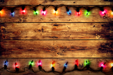 Wall Mural - christmas and new year rustic background, vintage planked dark wood with lights and free text space 