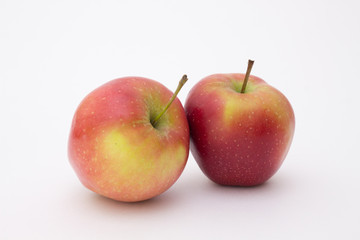 two red apples on white background