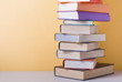 © motizova - Stack of colorful books. Education background. Back to school. Copy space for text.