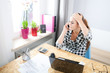 © leszekglasner - Stressed woman in home office explains by phone misunderstanding