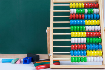 Decoration made of  table, abacus and school supplies.Back to school theme.