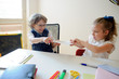 © unguryanu - Funny little pupils sit at one desk.