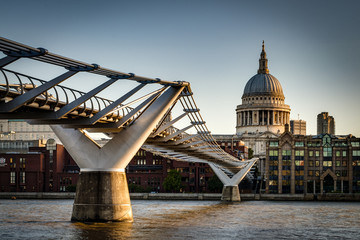 Wall Mural - St. Paul's Cathedral and Millennium Bridge, officially known as the London Millennium Footbridge, across the river Thames