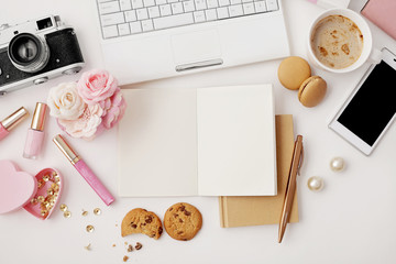 notebook keyboard, diary, sketchbook, notebook , photo camera and coffee on white background. flat lay. top view office table desk