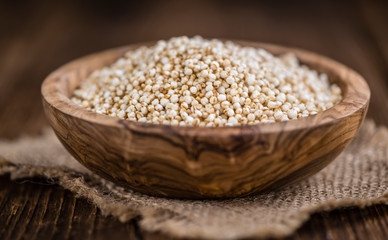 Canvas Print - Puffed Quinoa (selective focus; close-up shot) on wooden backgro