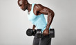 © Jacob Lund - Healthy african man exercising with dumbbells