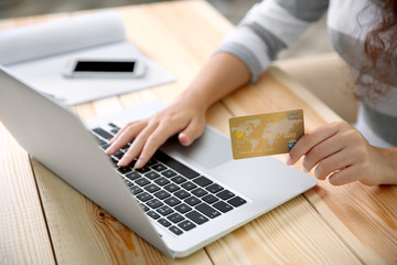 Wall Mural - Woman hands using credit card and laptop for online shopping