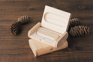 Wooden box with usb stick on dark wooden background. Packaging for USB drives. Two boxes with usb-stick for photographer