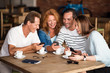 © zinkevych - Positive men and women using smart phones