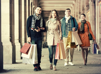 People walking with shopping bags