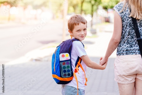 Fotografia, Obraz 7 years old boy going to school with his mother