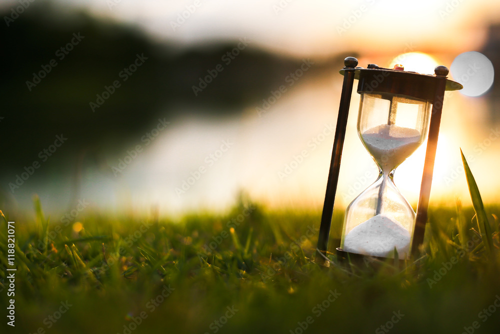 Hourglass in the dawn time - obrazy, fototapety, plakaty 