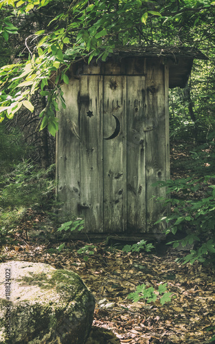 Classic Rural Outhouse. A typical old fashioned outhouse bathroom with