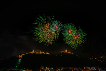 Fireworks at Kao Wang mountain, over the cityscape of Petchburi, Thailand