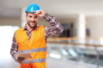 Smiling worker with digital tablet