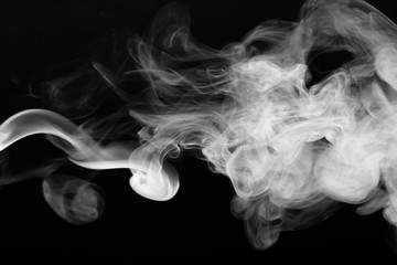 Cloud of smoke on black background. Selective focus