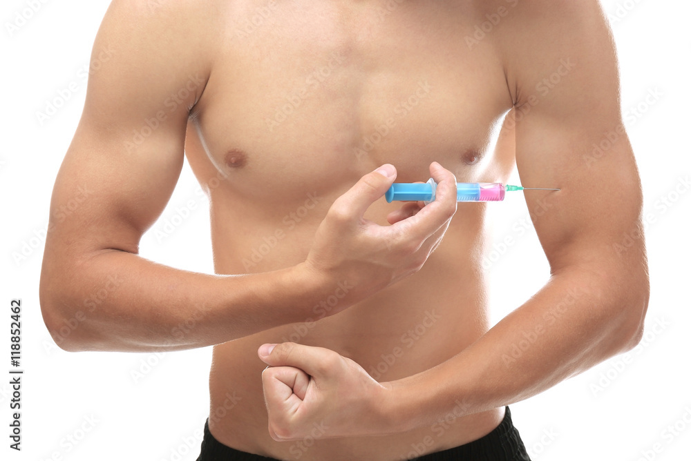 Sportsman injecting himself with steroids on white background