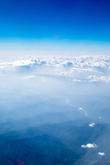 Wall Mural - Aerial view of cloud and sky from airplane,Traveling concept