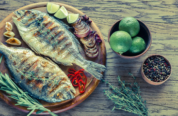 Wall Mural - Grilled Dorade Royale Fish on the wooden board