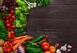 Frame of fresh vegetables on wooden background with copy space