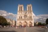 Fototapeta Paryż - Notre Dame de Paris. France. Ancient catholic cathedral on the quay of a river Seine. Famous touristic architecture landmark in summer
