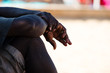 black man resting, hands detail, immigration and integration concept