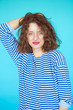 © kegfire - Summer fashion girl with curly hairstyle and striped shirt