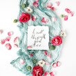 © Floral Deco - inspirational quote written in calligraphy style on paper with dry white tulips, eucalyptus petals and pink textile on white background. Flat lay, top view