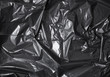 A full page of black bin liner plastic texture