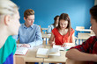 © Syda Productions - group of students with books at school lesson