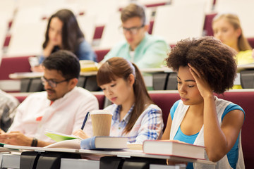 Canvas Print - group of students with coffee writing on lecture