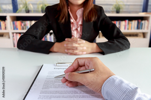 Fotografía Businessman sign the contract with businesswoman sitting on blur