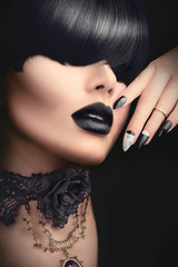 Wall Mural - Fashion model girl with black gothic hairstyle, makeup, manicure and accessories