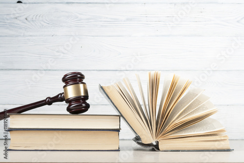 Fotografía Law concept - Book with wooden judges gavel on table in a courtroom or enforcement office