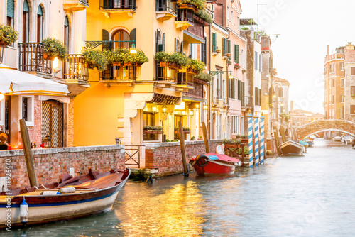 Fotografie, Obraz Small romantic water canal with restaurants in Dorsoduro region in Venice