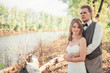 © ruslan1117 - bride and groom standing on a background of grass  lakes