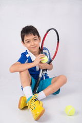 Wall Mural - Little boy playing tennis racket and tennis ball in hand