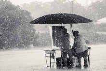 Two Persons Endure Struggle On Obstacles Rainstorm, Black White Tone