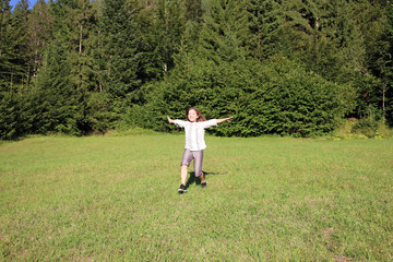 Wall Mural - happy little girl running on field