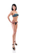 © Khorzhevska - Mid adult young fit woman posing in studio in swimsuit over whit