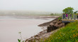 Tourists and local people observe the tidal bore roll into Moncton, New Brunswick, Canada.
