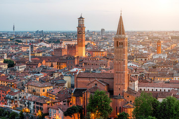 Wall Mural - Verona aerial view on illuminated old town on the sunset in Italy