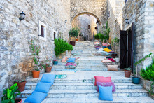 Stairs With Pillows And Stone Arch In Ulcinj Old Town, Montenegro.