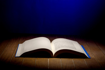 Open Book on wood background