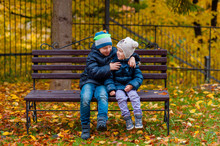 Boy And A Girl In Autumn Park